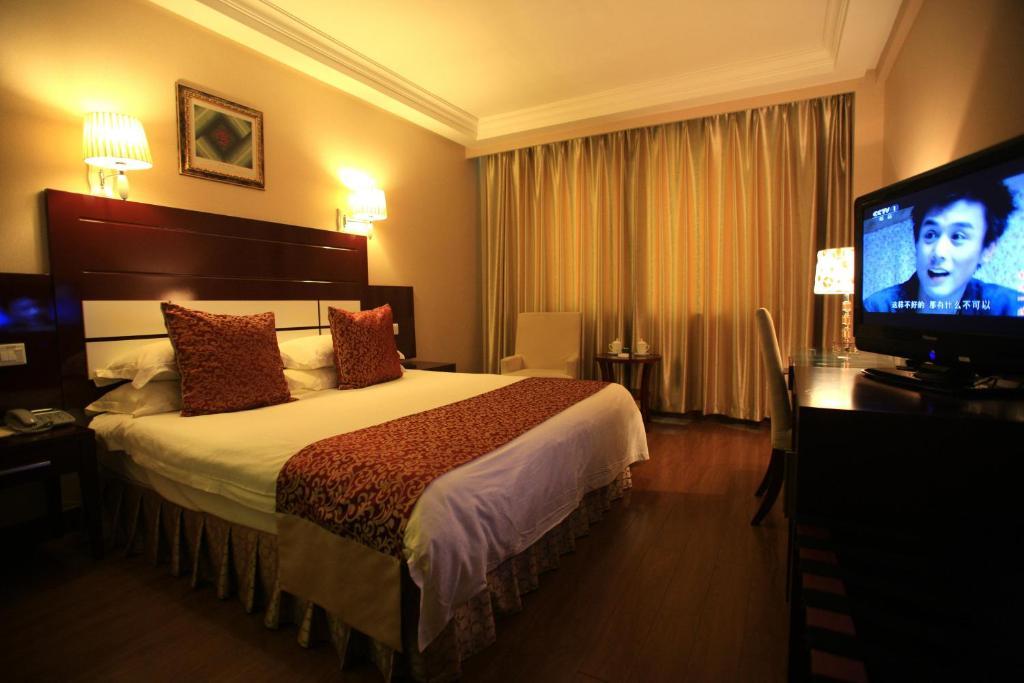 Overseas Chinese International Hotel Qingdao Kamer foto