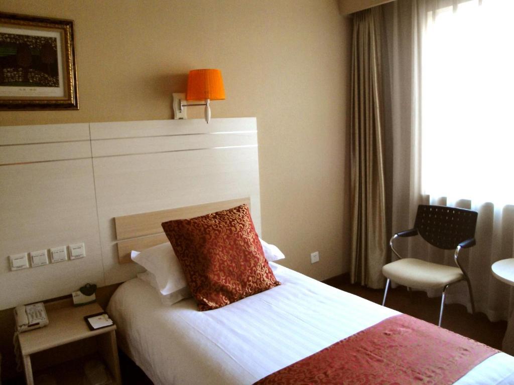 Overseas Chinese International Hotel Qingdao Kamer foto